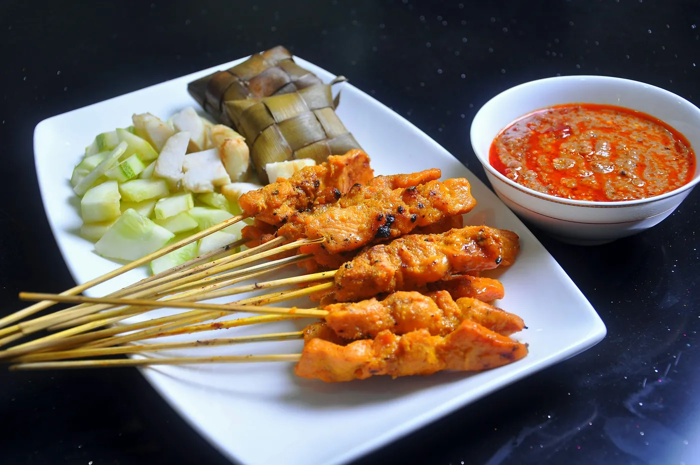 Chicken skewers with peanut dipping sauce