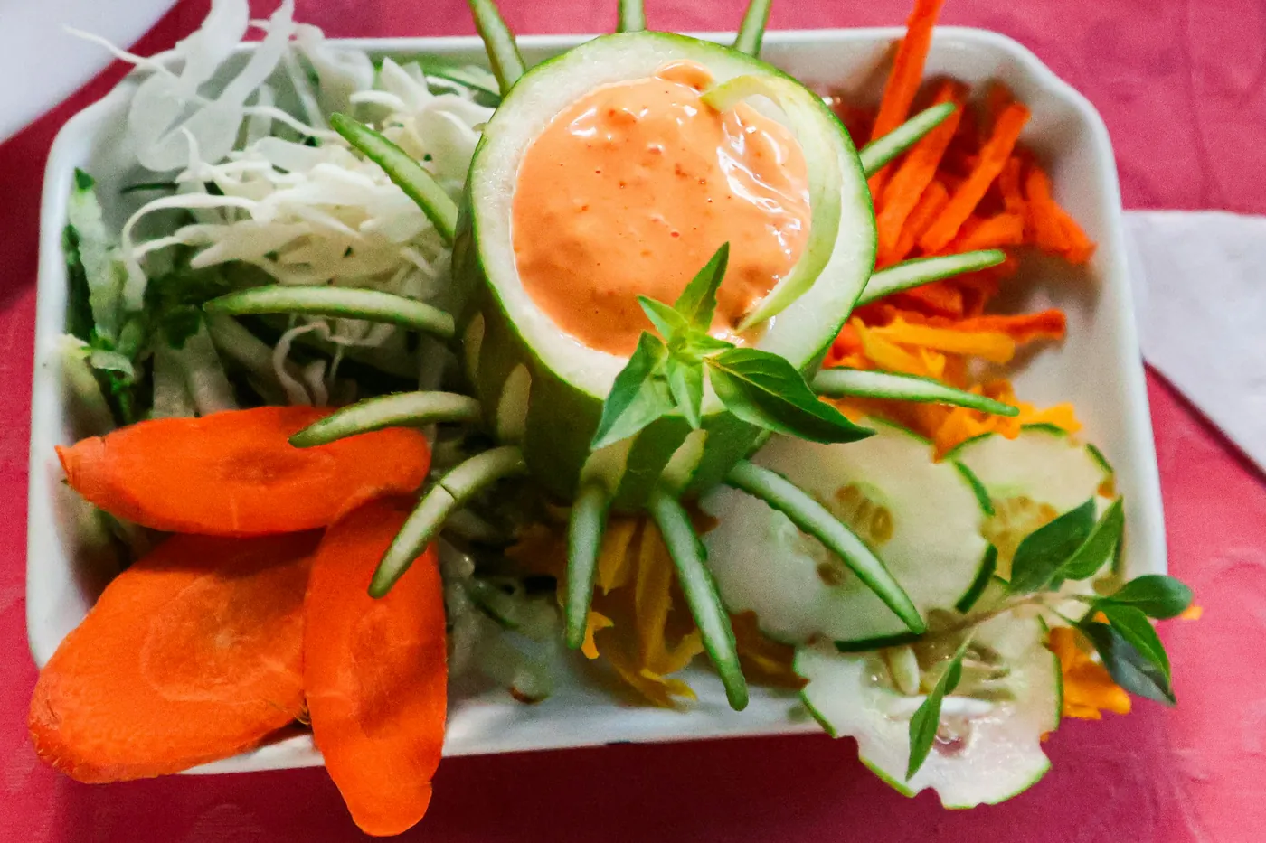 A fresh salad of carrot, cucumber and greens